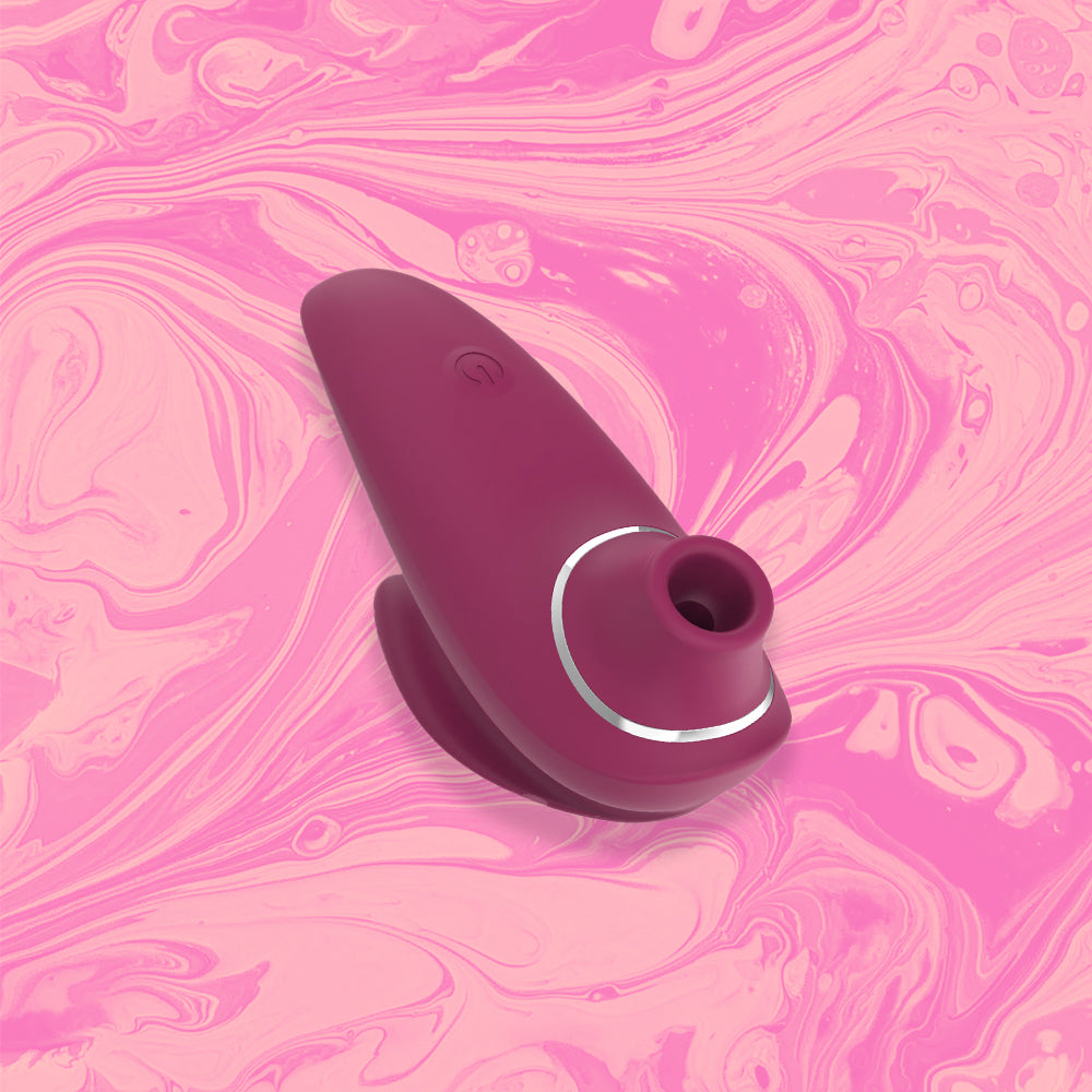 Clio Clitoris Sucker - Soft touch Silicone, 10 sucking modes, waterproof & USB rechargeable in colour wine red