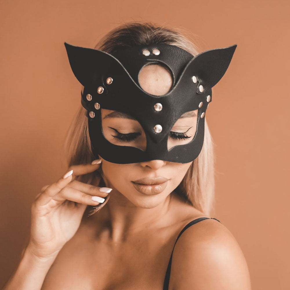 A woman posing wearing the Artemins Bondage Mask 