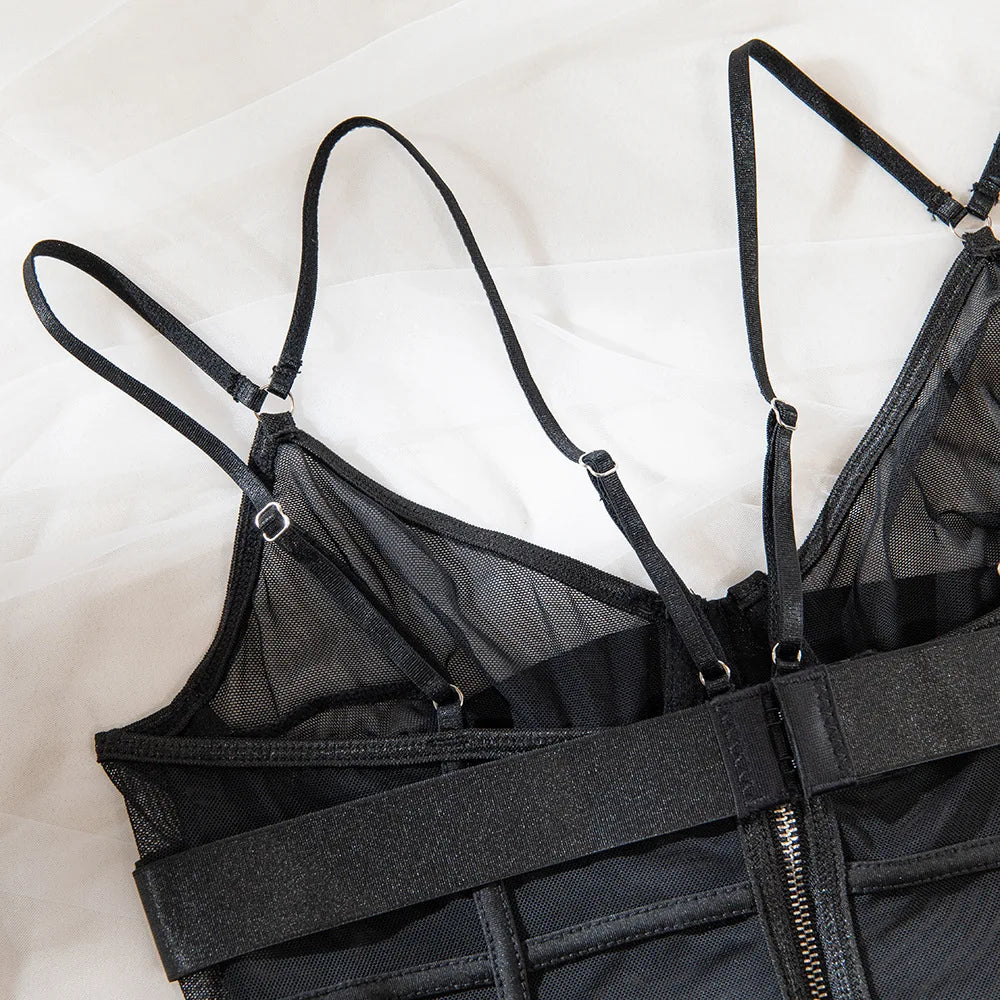 Flat lay of The Arabella lingerie bodysuit showing rear zip, mesh texture, and thong cut.