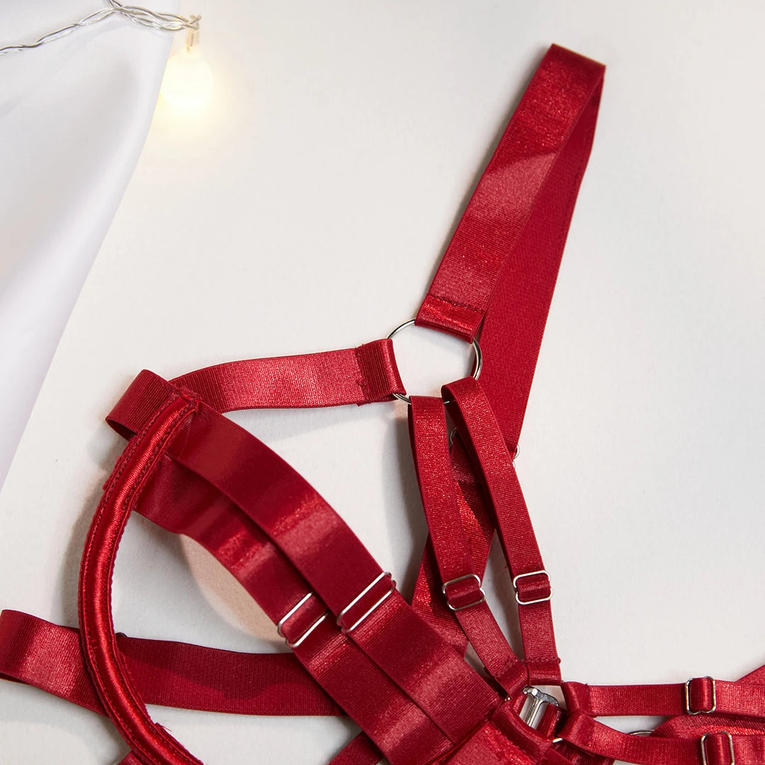 Close-up of The Harlow’s open cup bodysuit with silver-tone strappy lingerie hardware.