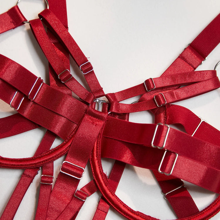 Close-up of The Harlow’s open cup bodysuit with silver-tone strappy lingerie hardware.