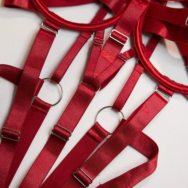 Close-up of The Harlow’s open cup bodysuit with silver-tone strappy lingerie hardware.

