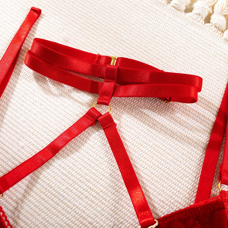 Close-up of gold hardware and red straps on The Ravena luxury lingerie set
