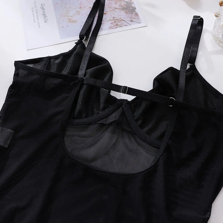 Rear view of The Esme bodysuit, highlighting mesh and harness detail.