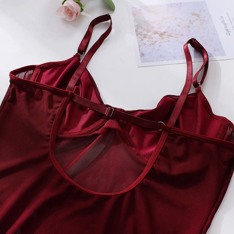 Rear view of The Esme bodysuit, highlighting mesh and harness detail.